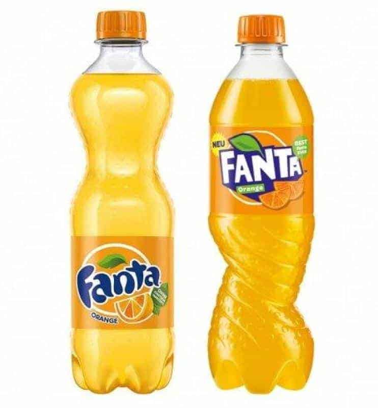 Reklamowe butelki FANTA 1 Dwie butelki pomarańczowego napoju Fanta.