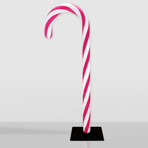 Laska cukrowa w czerwono-białe paski stojąca na czarnej podstawce na szarym tle